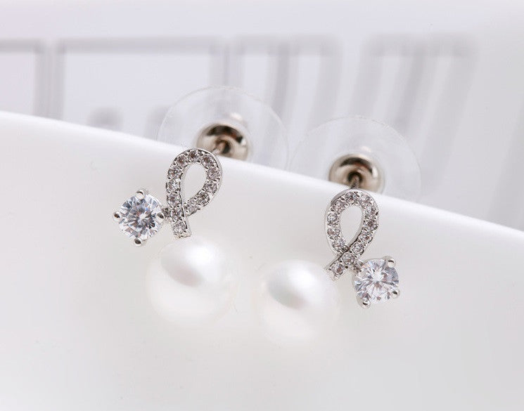 Twist of Fate Pearl Stud Earrings